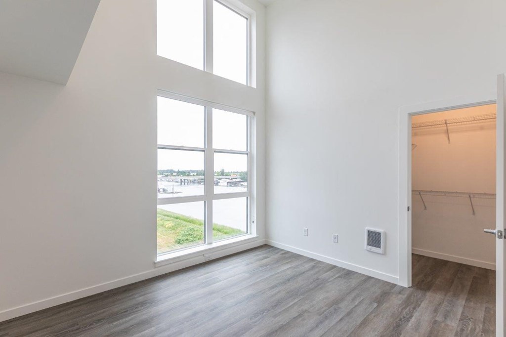 Harbor Sky Bedroom with Large Windows and Attached Walk-In Closet
