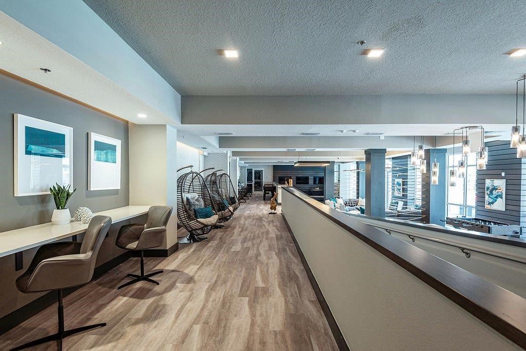 a room with a bunch of chairs and a table