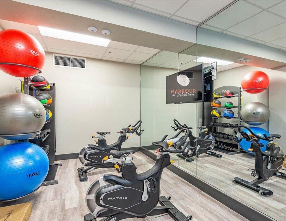 a room filled with lots of different types of exercise equipment