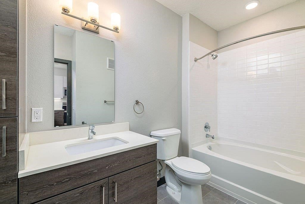 a bathroom with a toilet sink and bathtub