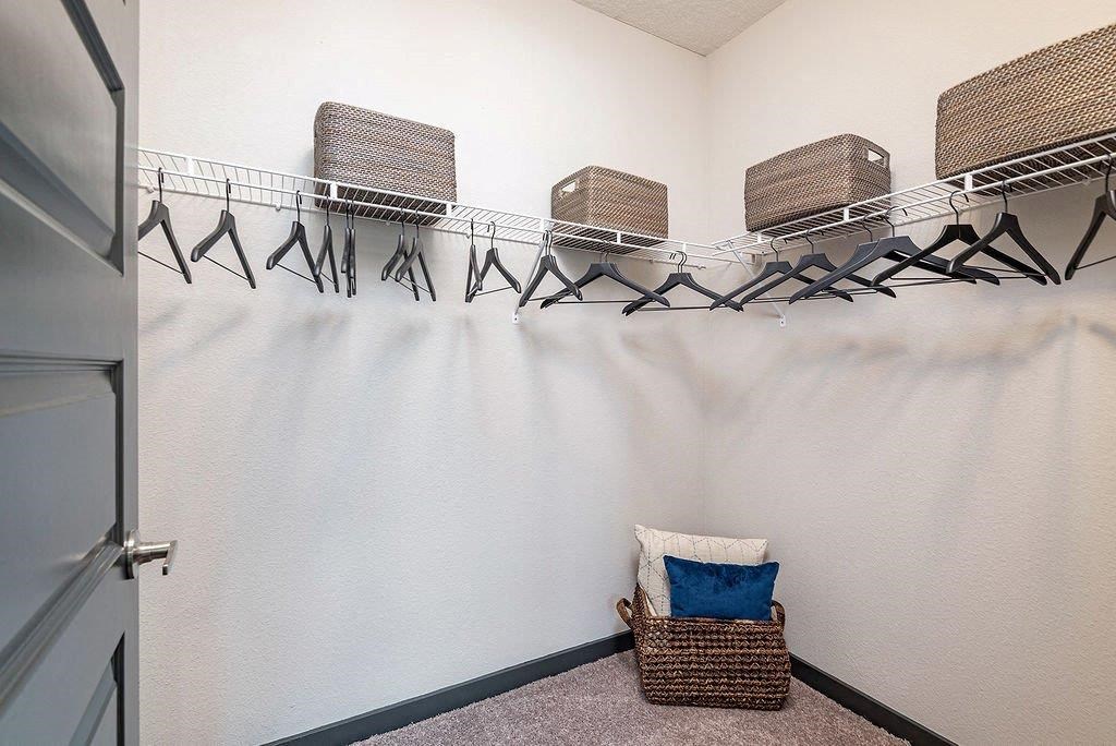 a room with a chair and a rack with chairs on it