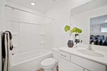 a bathroom with a sink toilet and bathtub - Photo Gallery 20