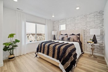 a bedroom with a bed and a window - Photo Gallery 19