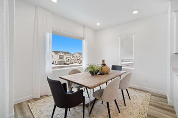 a dining room with a table and chairs - Photo Gallery 4