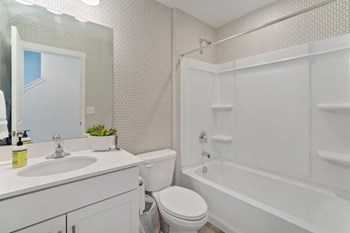 a bathroom with a sink toilet and bathtub - Photo Gallery 22