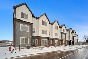 a row of houses on a snowy street - Photo Gallery 27