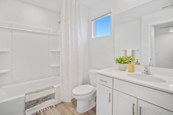 a bathroom with a toilet sink and bathtub - Photo Gallery 16