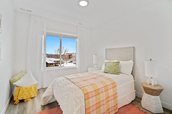 a bedroom with a bed and a window - Photo Gallery 13