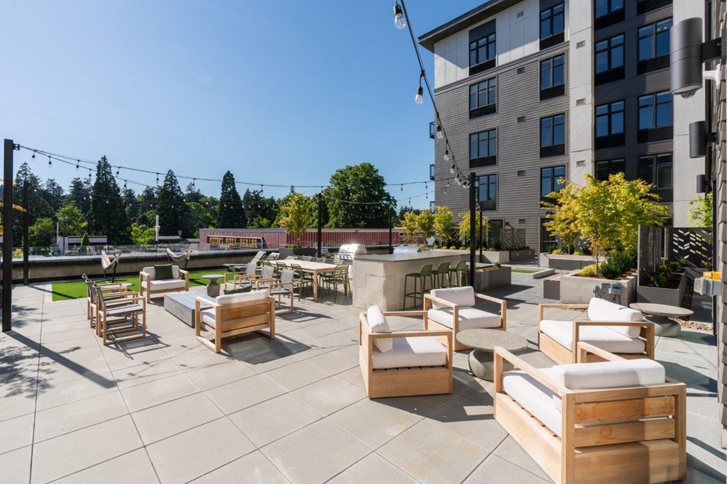 a patio with chairs and tables on a patio