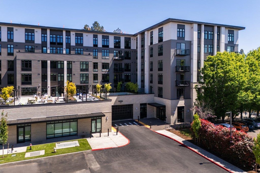 a view of the exterior of a building with a parking lot