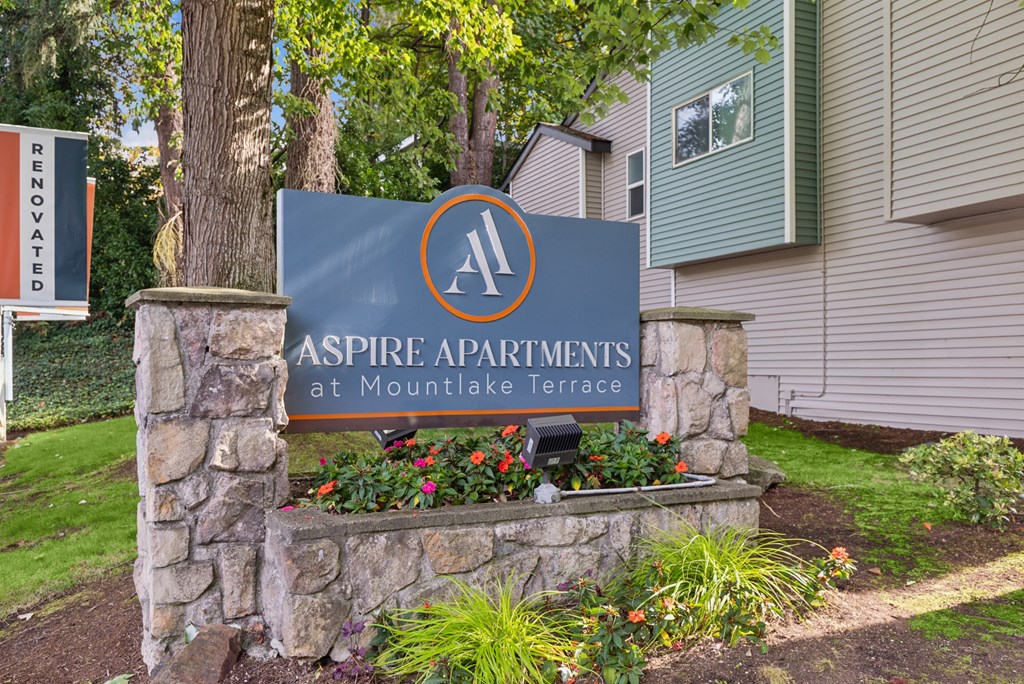 A sign for Aspire Apartments at Mountlake Terrace is shown.