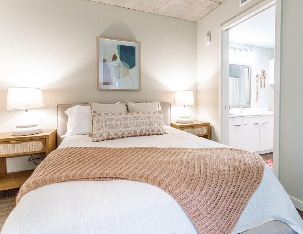 a bedroom with a bed and a bathroom