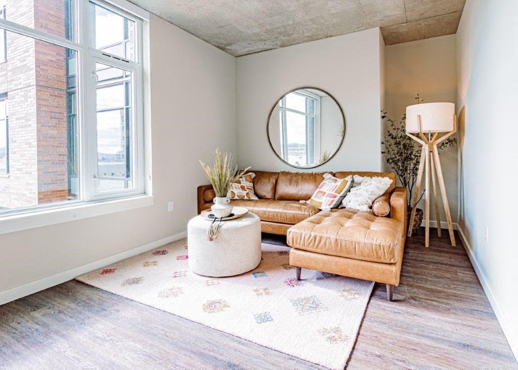 a living room with a couch and a large window