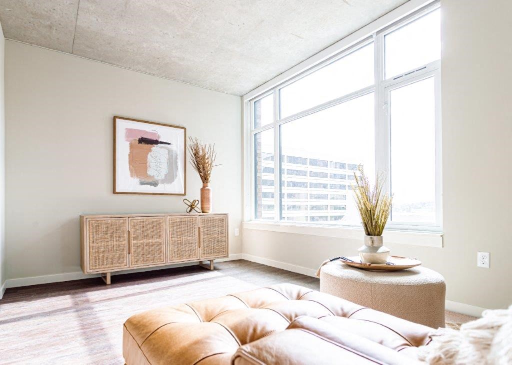 a living room with a couch and a large window