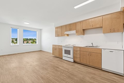 A kitchen with wooden cabinets and white appliances.