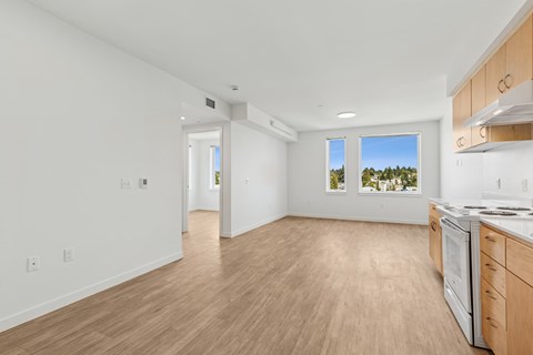 A kitchen with a dishwasher and a refrigerator.