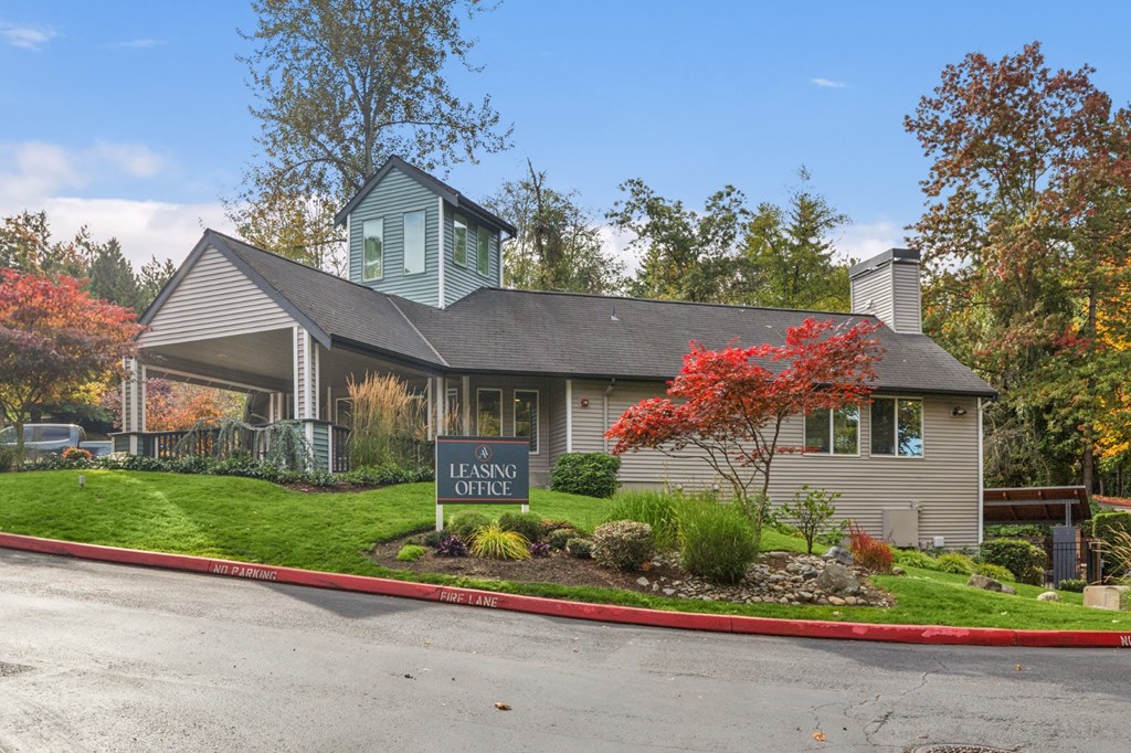 A house with a Leasing Office sign in front.