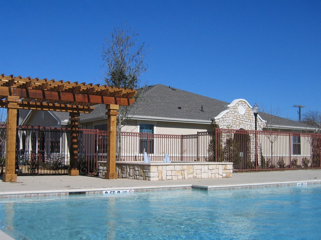 The Positano Apartments Pool Area and Building Exterior