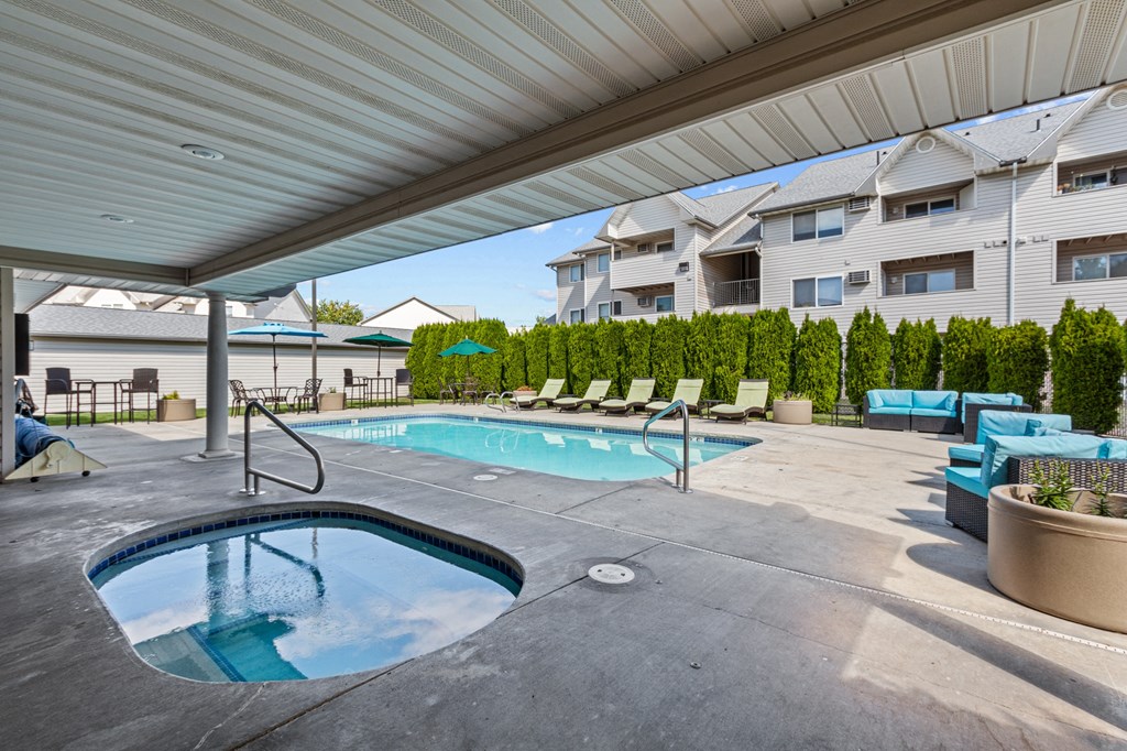 our apartments have a resort style pool and spa with lounge chairs