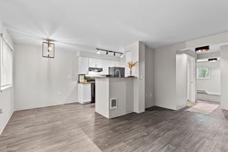 a kitchen and living room with hardwood floors - Photo Gallery