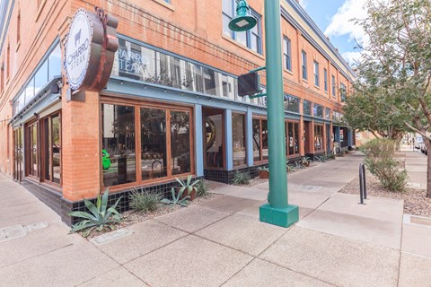 A street view of a building with a sign that reads "CHAMBER".