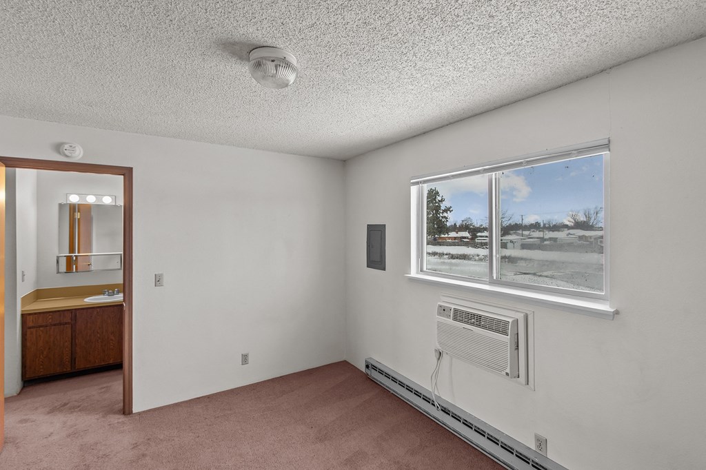 Creekside Apartments the living room of an empty house with a window