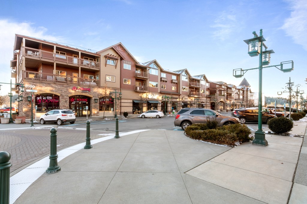 a city street with a large building in the background
