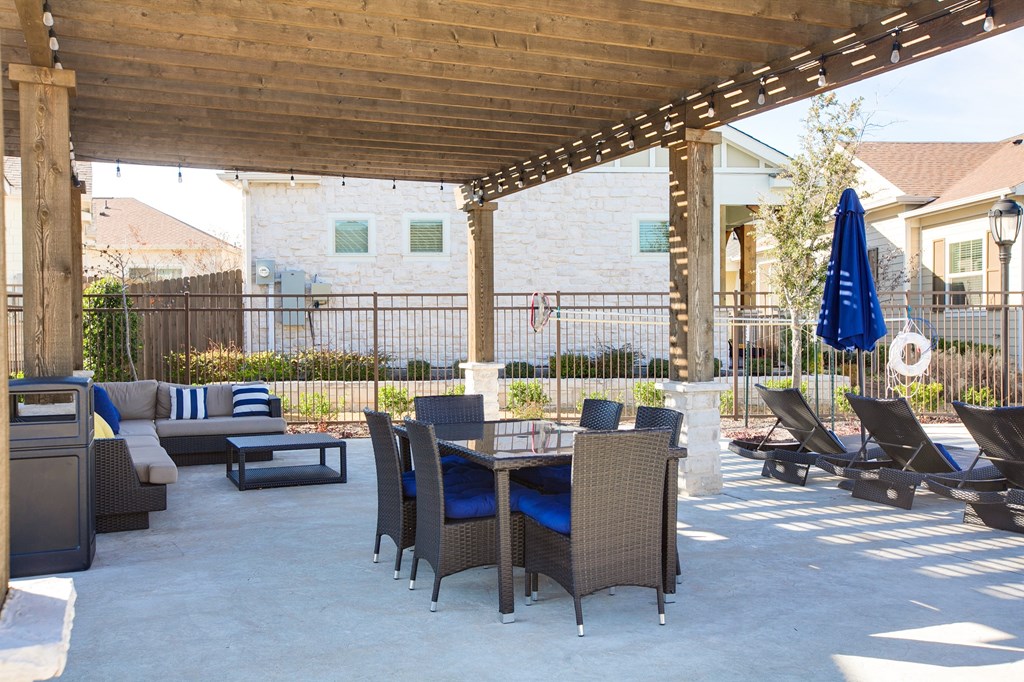 Horizon at Premier Apartments Outside Clubhouse Patio with Lounging Chairs.
