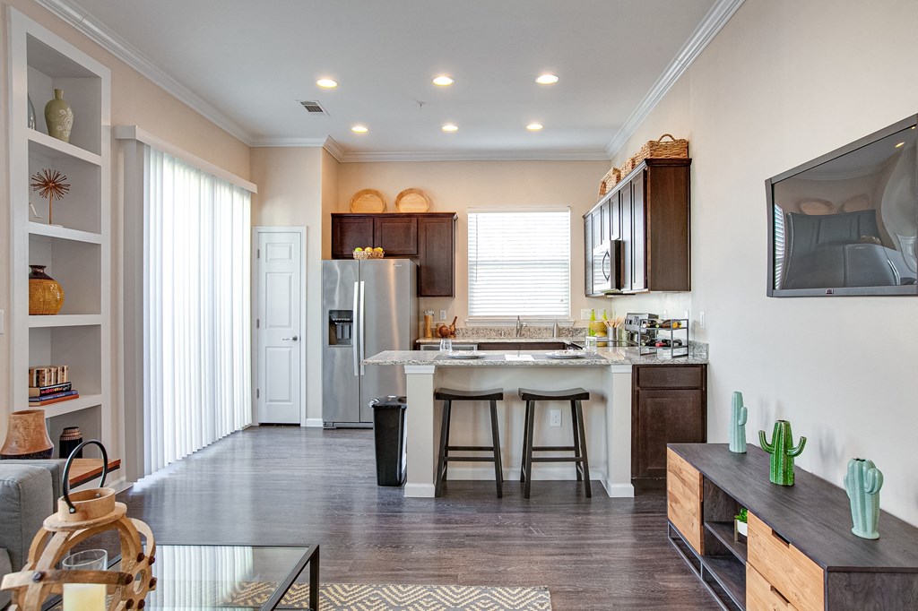 Horizon at Premier Apartments Living Room and Kitchen View with Built In Book Shelf.
