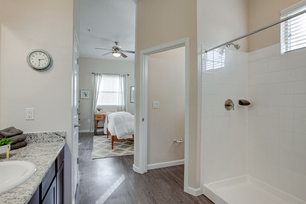 Horizon at Premier Apartments Master Suite with Walk-in shower, toilet room, and vanity sink.