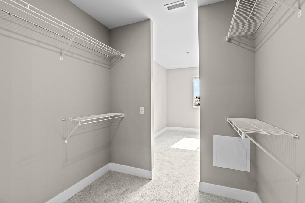 a spacious walk in closet in a 555 waverly unit