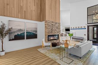 a rendering of a living room with a stone fireplace and wood floors