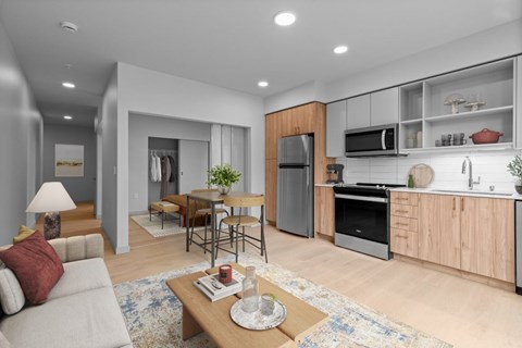 A modern kitchen with wooden cabinets and stainless steel appliances.
