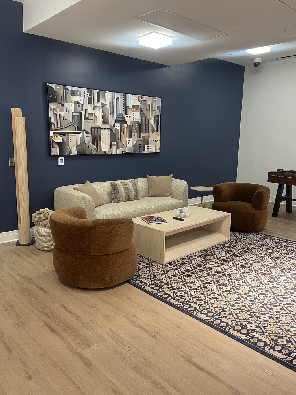 A living room with a couch, armchair, and coffee table.