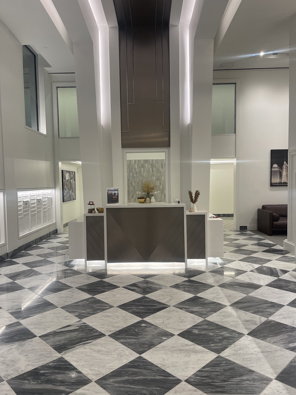 A black and white checkered floor in a hallway.