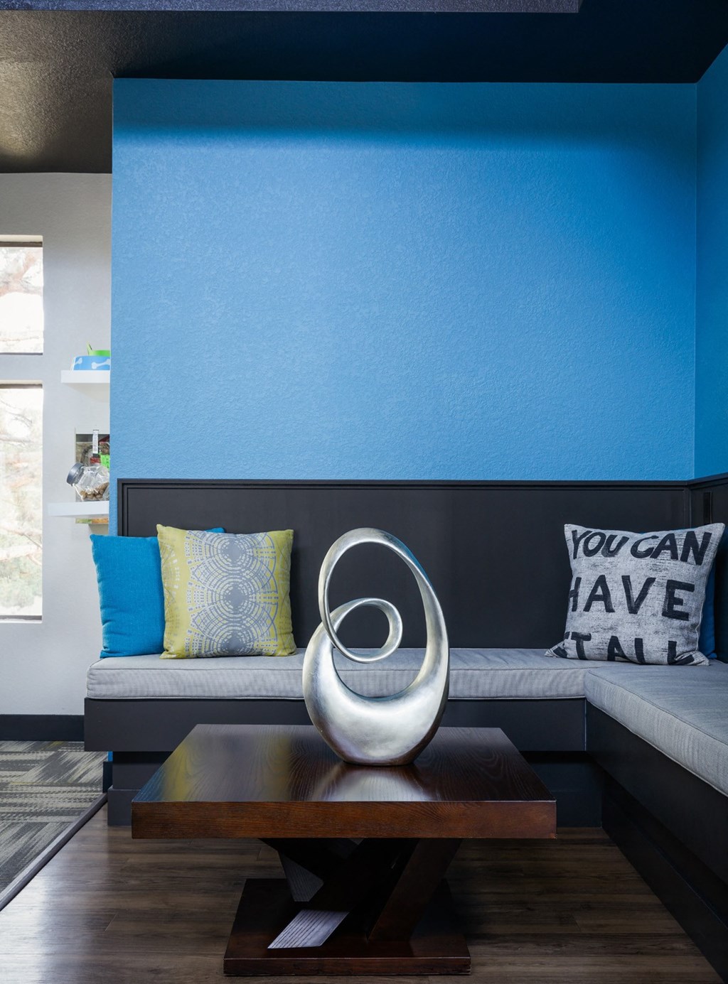 Ironwood at the Ranch Apartments Seating area with blue wall