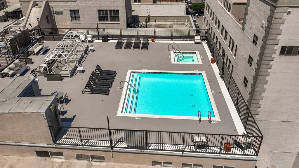 an aerial view of a swimming pool on the roof of a building