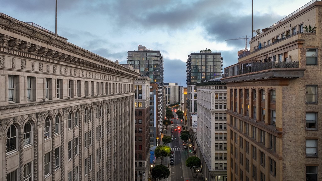 a view of a city street from the roof of a building