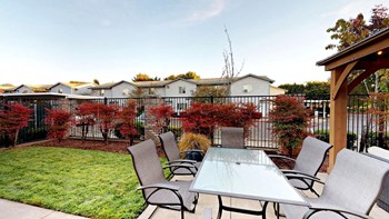 Jenna-Village-Club-House Outdoor Seating Area Jenna-Village-Club-House Outdoor Seating Area - Photo Gallery 3