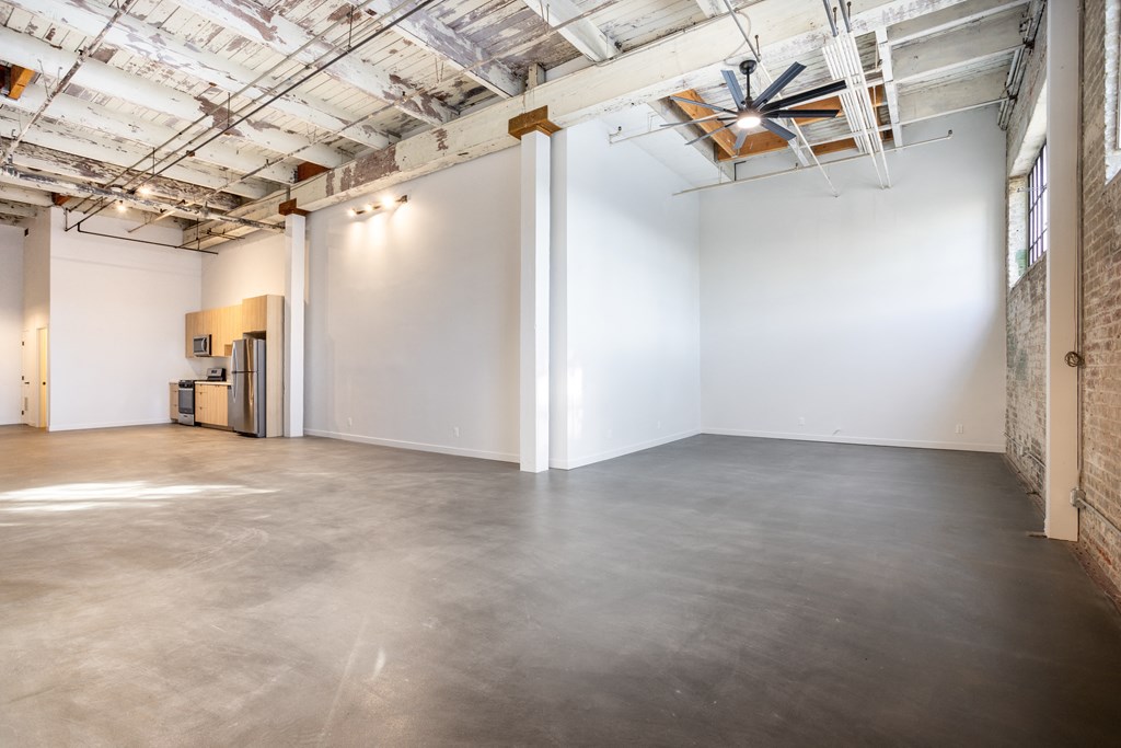 Santa Fe Art Colony  room with a concrete floor and white walls