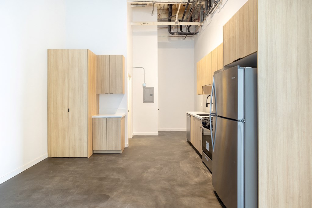 Santa Fe Art Colony  kitchen with a refrigerator and a stove and cabinets