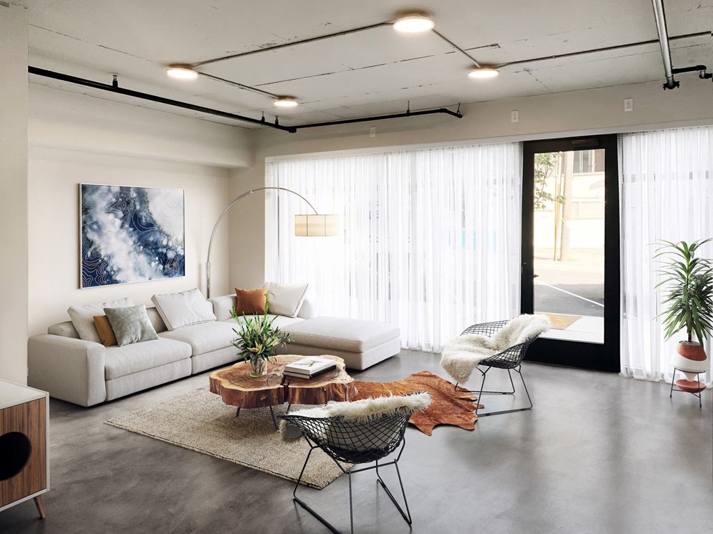 Geo Staged Living Room with Sofa and Large Windows