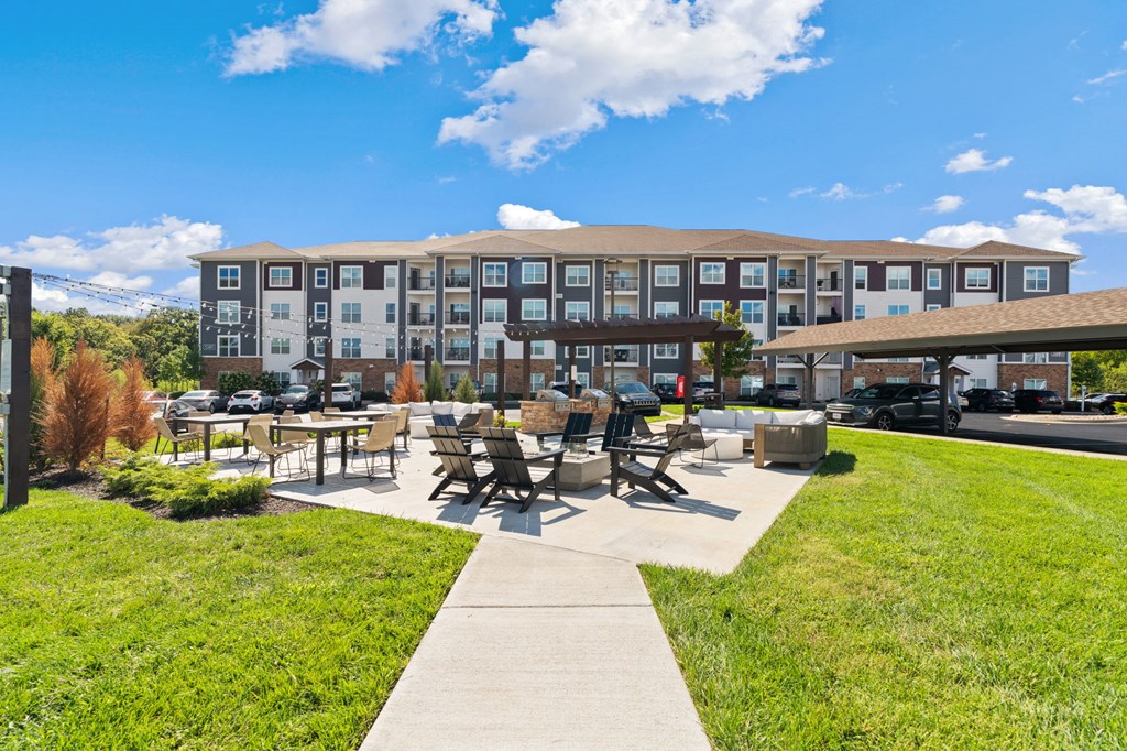 A large building with a grassy area in front of it.
