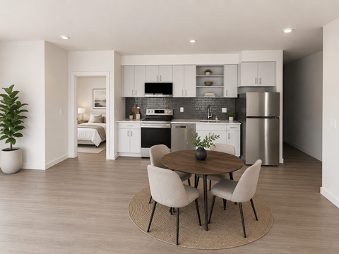 A modern kitchen with a dining table set for four.