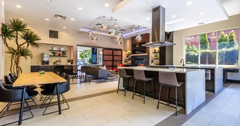 a kitchen and dining room with a table and chairs