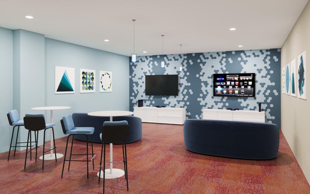 Adara SeaTac Apartments Virtual Reality Room with Game Consoles, TVs, and Seating