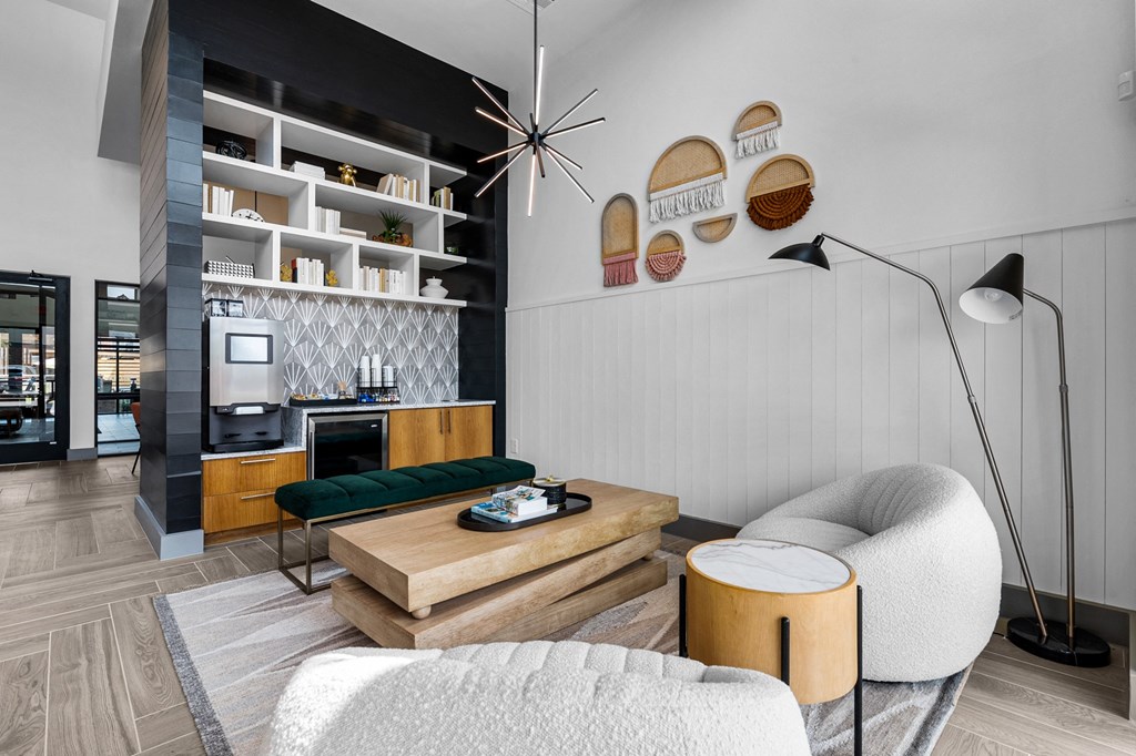 a living room filled with furniture and a large window