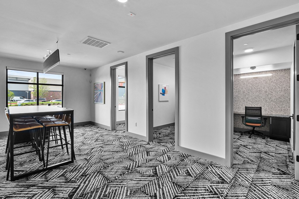 a room with a table and chairs in it