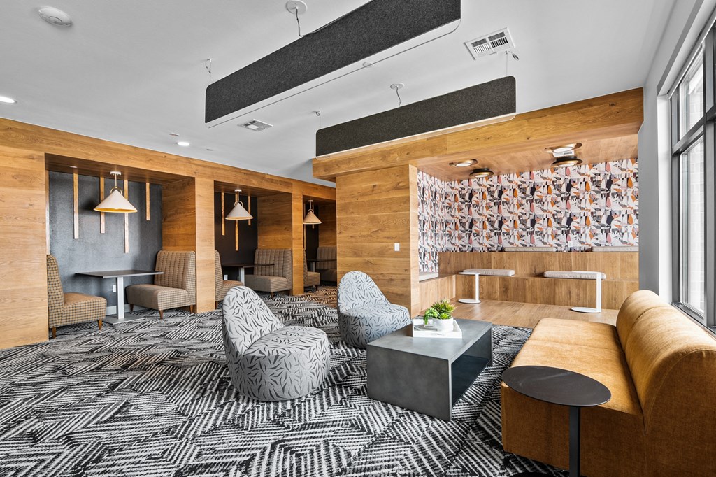 a room with a couch chairs and a coffee table