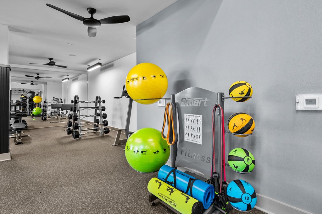 the gym at the enclave at woodbridge apartments in sugar land, tx
